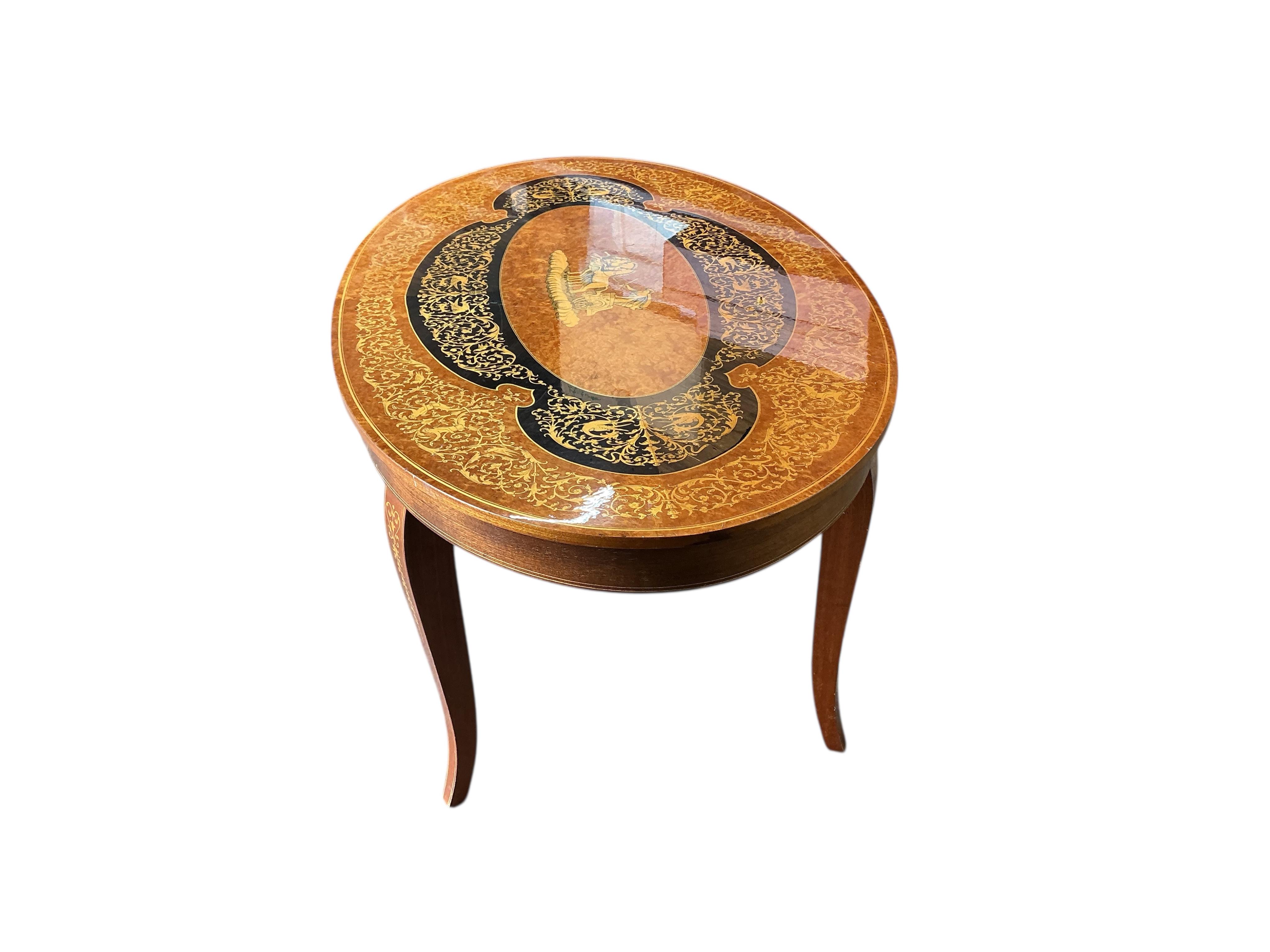 A Sorrento marquetry oval bird's eye maple coffee table, width 99cm, depth 58cm, height 47cm